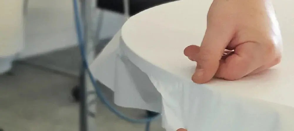 Photo close up of cover styl furniture wrap being installed to a table