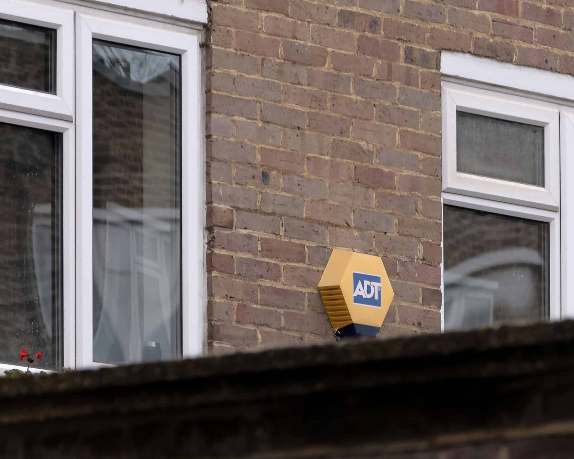A home security alarm by the property's windows.