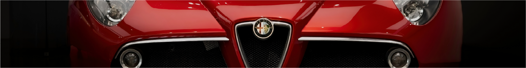 Close-up of a red Alfa with Alfa Romeo window tint installed