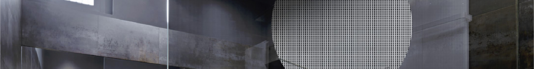 Black decorative window film installed on a glass partition with a metallic background