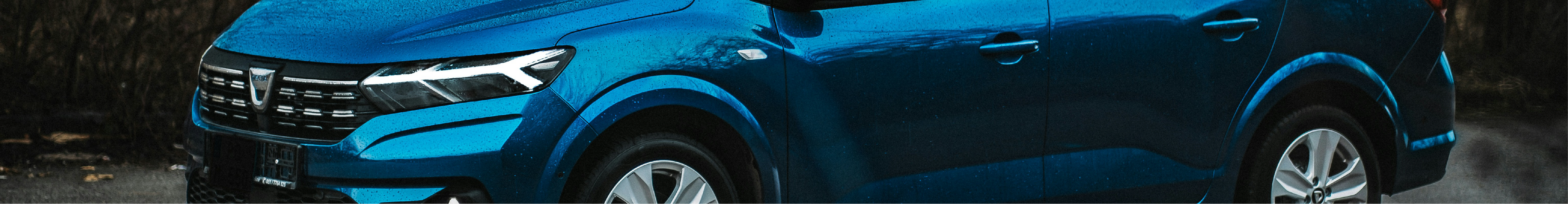 Cropped image of a blue Dacia with Dacia Window Tints installed all around