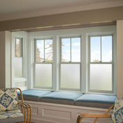 Frosted window vinyl installed on the lower windows in a modern living room