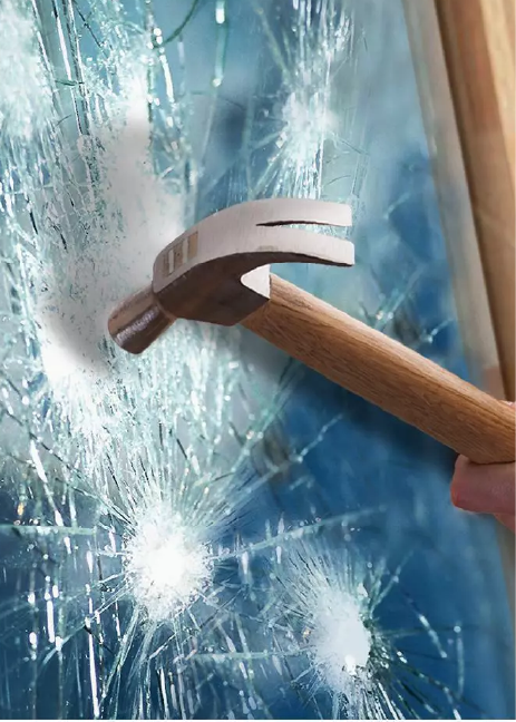 files/Hammer_hitting_window_with_anti_shatter_window_film_installed.webp