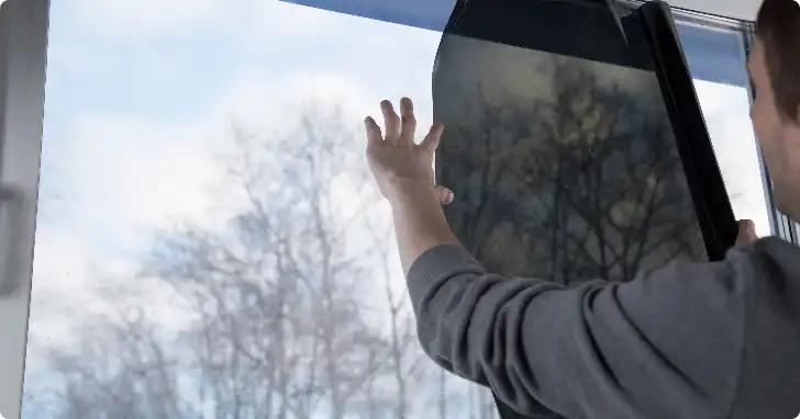 Installer fitting tinted window tint for home windows