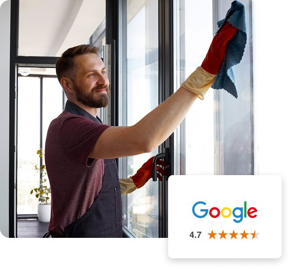Man cleaning conservatory windows after being tinted