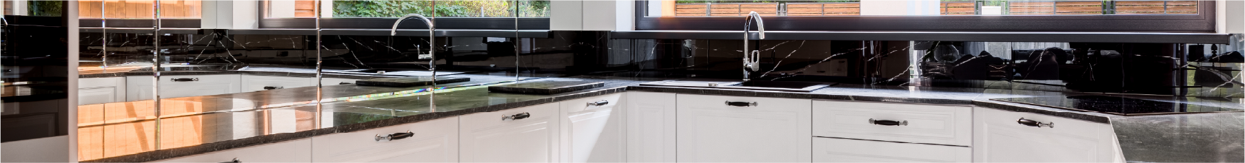 Kitchen after Evowrap kitchen wrapping with white doors and black marble worktop