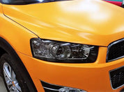 Close-up of an car's headlight and front grille with Oracal 970-223M car wrap installed