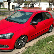 Oracol Gloss Cardinal Red installed on a car, and parked on a residential street with houses and trees