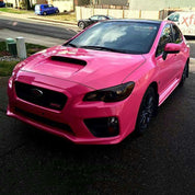 Oracal Gloss Soft Pink Subaru WRX parked on a street