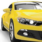 Oracal Gloss Crocus Yellow car with a clear focus on the front headlight and grille