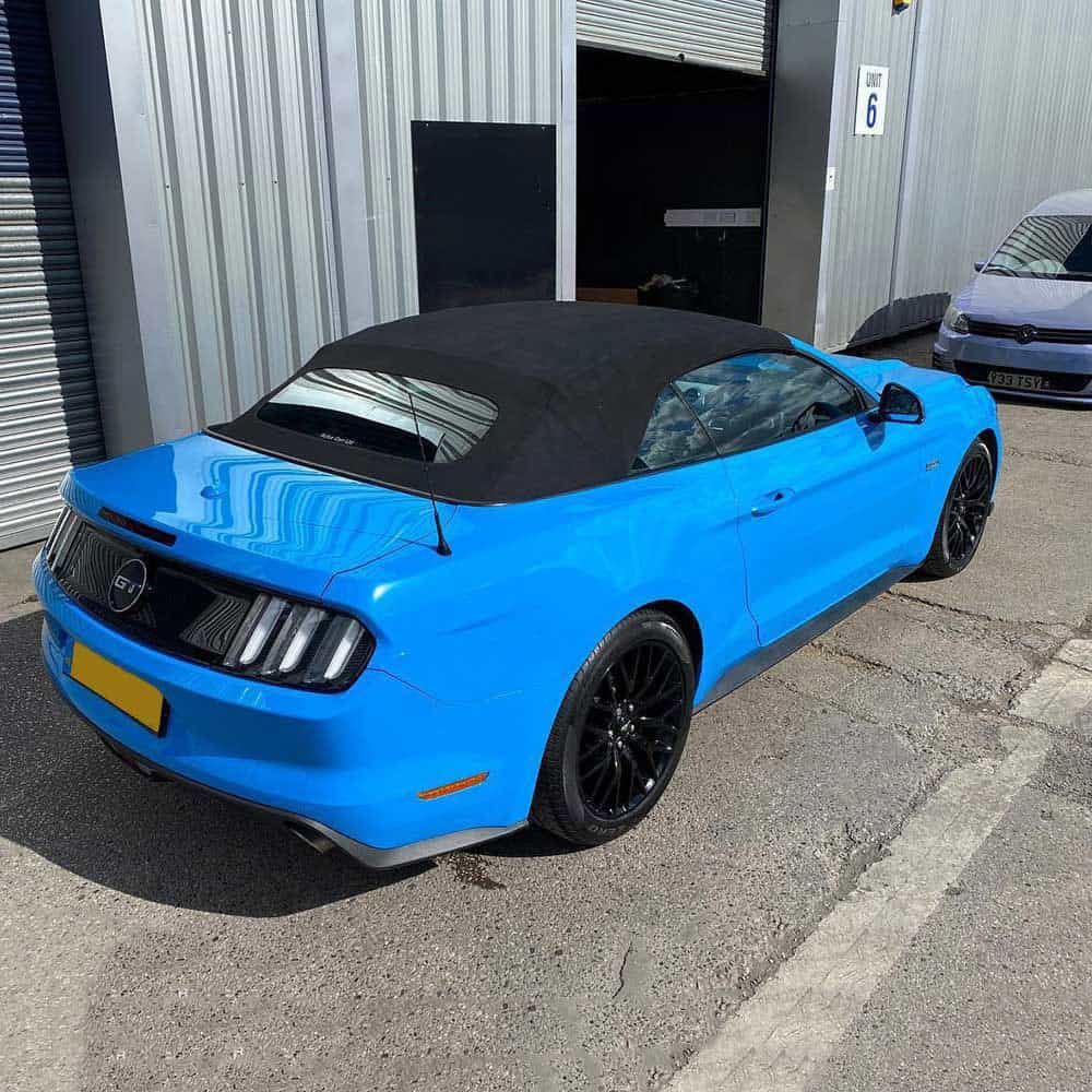 Oracal Gloss Fjord Blue convertible car parked in front of a building