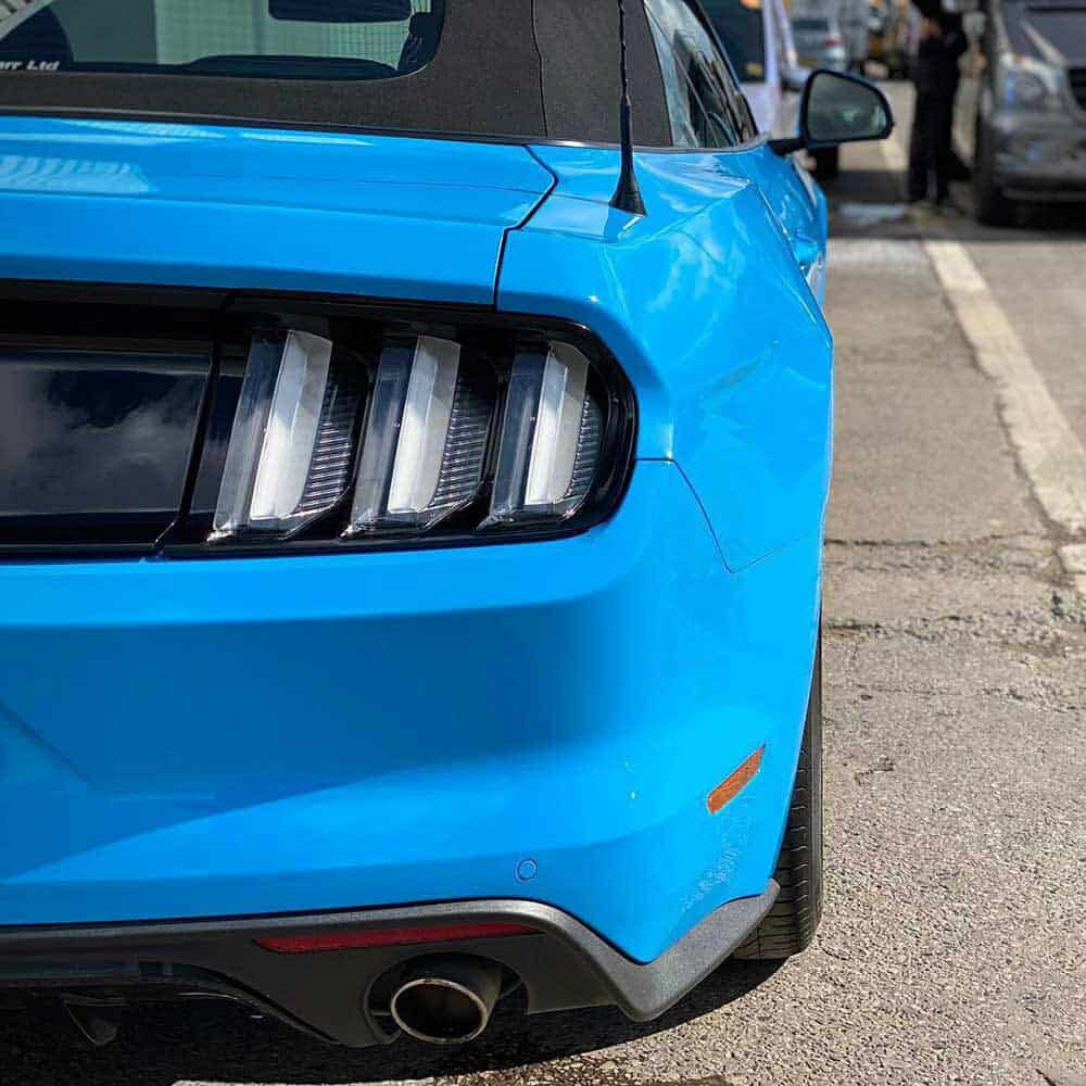 Close-up of an Oracal Gloss Fjord Blue car's rear end