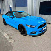 Oracal Gloss Fjord Blue Convertible car parked in front of a building with a blue shutter