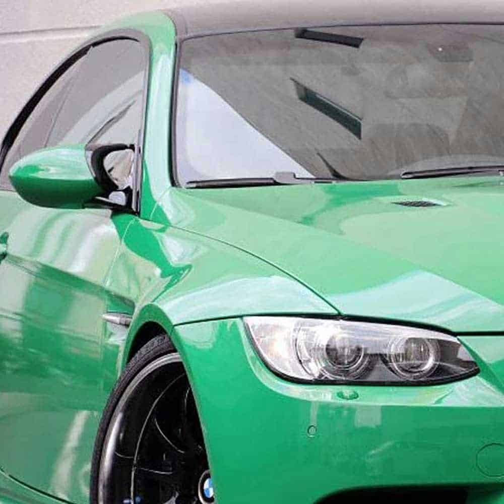 Close-up of an Oracal Gloss Police Green installed on a car's front left side