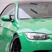 Close-up of an Oracal Gloss Police Green installed on a car's front left side