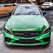 Oracal Gloss Police Green installed on a car parked on a road 