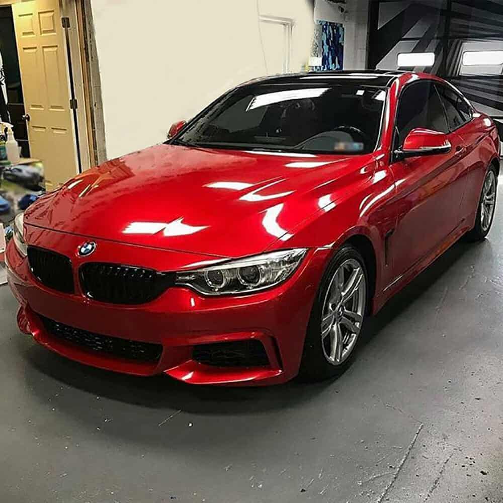 Oracal Gloss Luscious Lips installed on a car parked in a garage