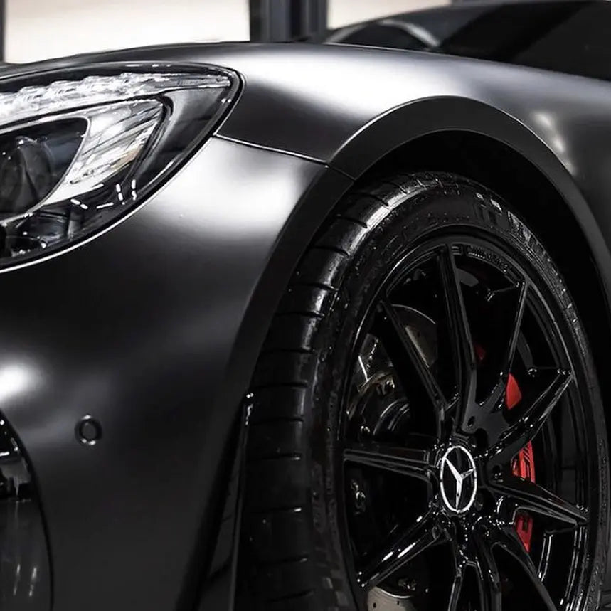 Close-up of a car wheel with super matt vehicle wrap installed