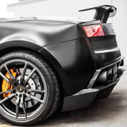 Super matt black sports car with a focus on the wheel and front bumper