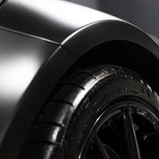 Close-up of a car wing with Oracal 970-070 vehicle wrap installed