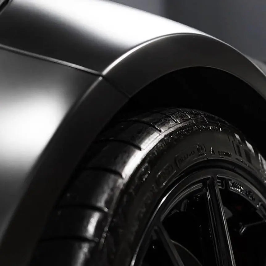 Close-up of a car wing with Oracal 970-070 vehicle wrap installed