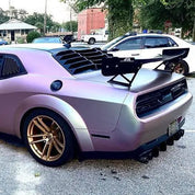 Matte pearl symphony car wrap on the rear of a modded car