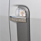 Silver car door handle with Oracal carbon fibre vinyl wrap installed