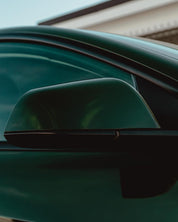 Side mirror of an Oracal Gloss Bottle Green car 