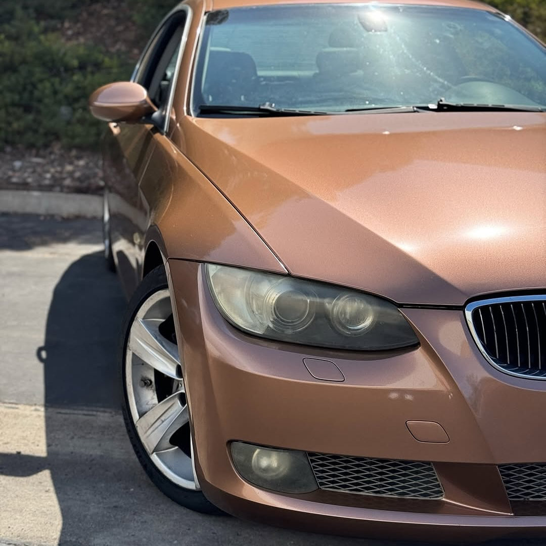 Oracal Gloss Bronze Antique Metallic  on a BMW car parked on a street