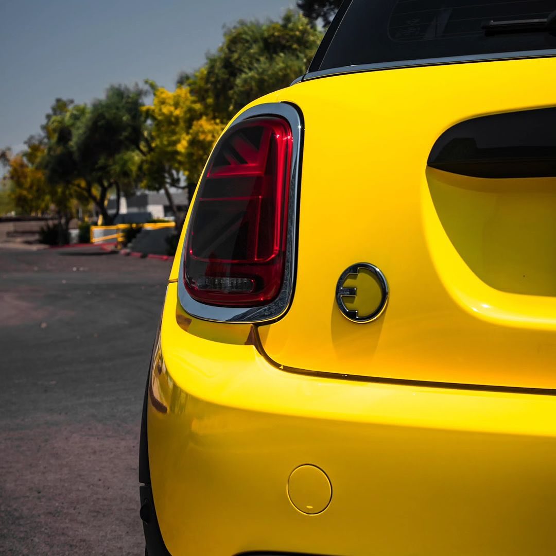Mini Cooper car's rear end with Oracal Gloss Canary Yellow wrap installed