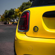 Mini Cooper car's rear end with Oracal Gloss Canary Yellow wrap installed