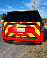 Oracal Gloss Chili Red installed on a vehicle with yellow and red reflective stripes on a road