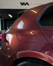 Close-up of an Oracal Gloss Cranberry car's rear side