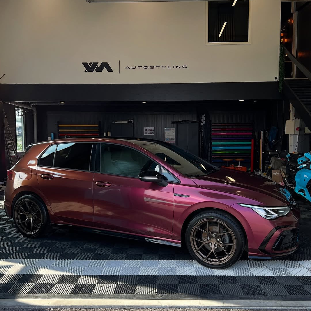 Oracal Gloss Cranberry on a Volkswagen car in a showroom