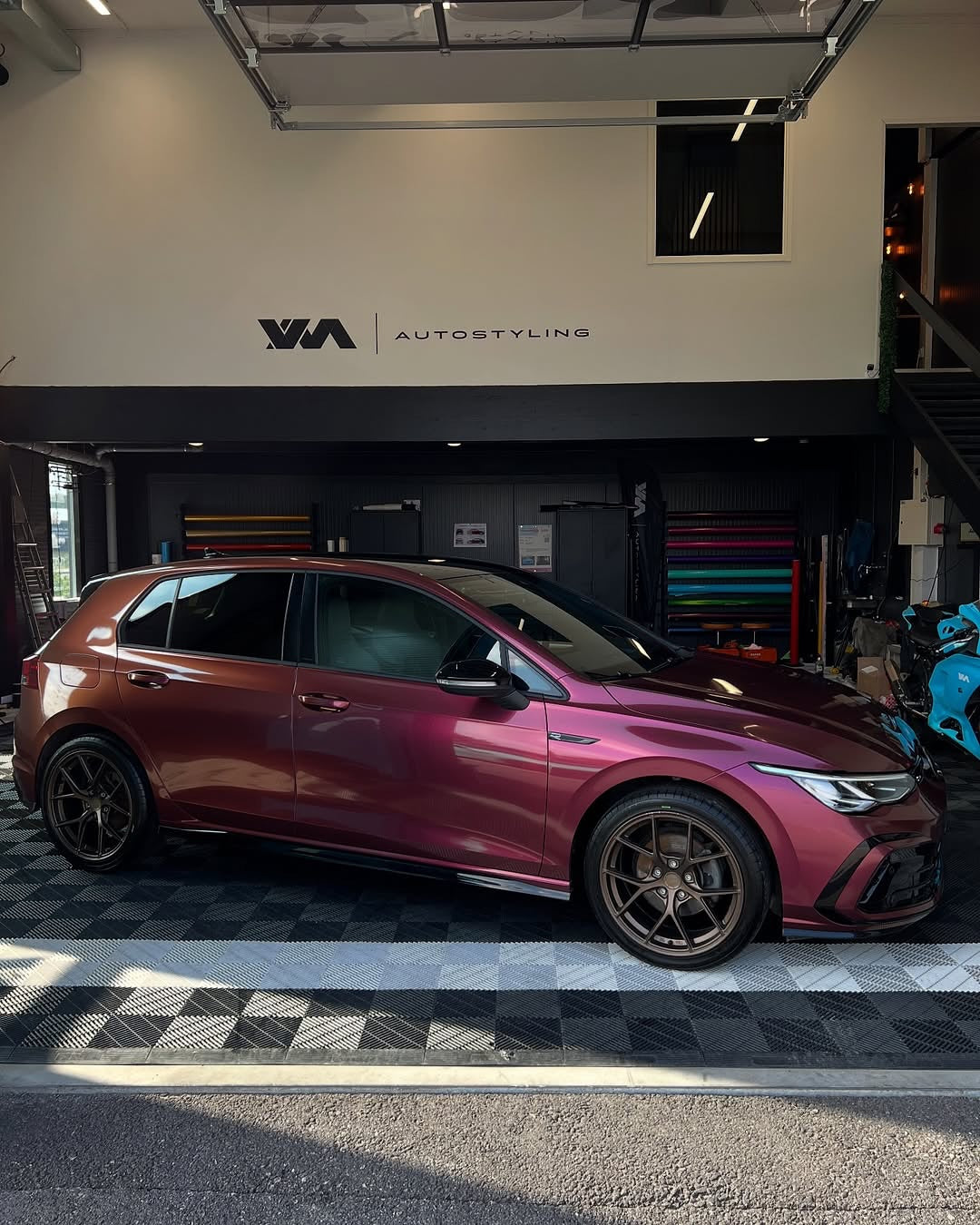 Oracal Gloss Cranberry on a Volkswagen car in a showroom