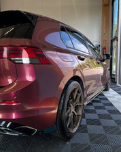 Oracal Gloss Cranberry car parked inside a building with a checkered floor