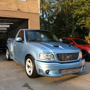 Oracal Gloss Dove Blue Metallic Ford truck parked in a driveway