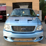 Oracal Gloss Dove Blue Metallic Ford truck parked in front of a garage