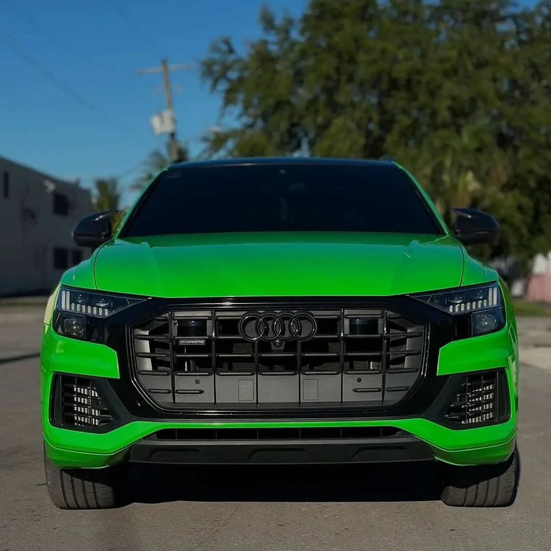 Oracal Gloss Grass Green Audi SUV parked on a street with trees and buildings