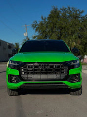 Oracal Gloss Grass Green Audi SUV parked on a street with trees and buildings