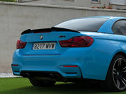 Oracal Gloss Ice Blue installed on a BMW car with a visible license plate against a concrete wall