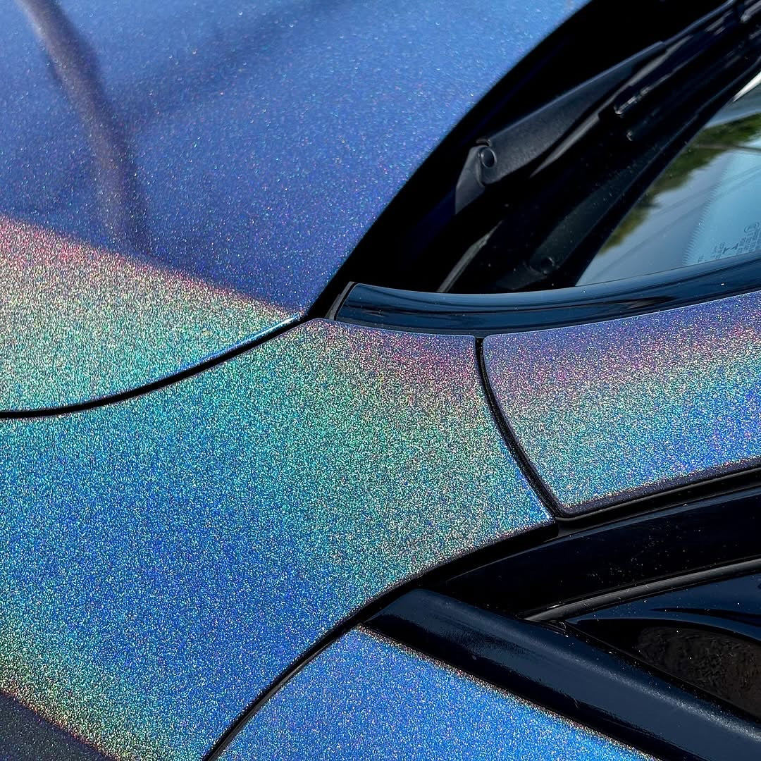 Close-up of a car's hood with Oracal Gloss Intergalactic Blue installed