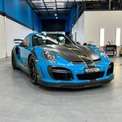 Sports car with Oracal Gloss Lagoon installed in a garage setting