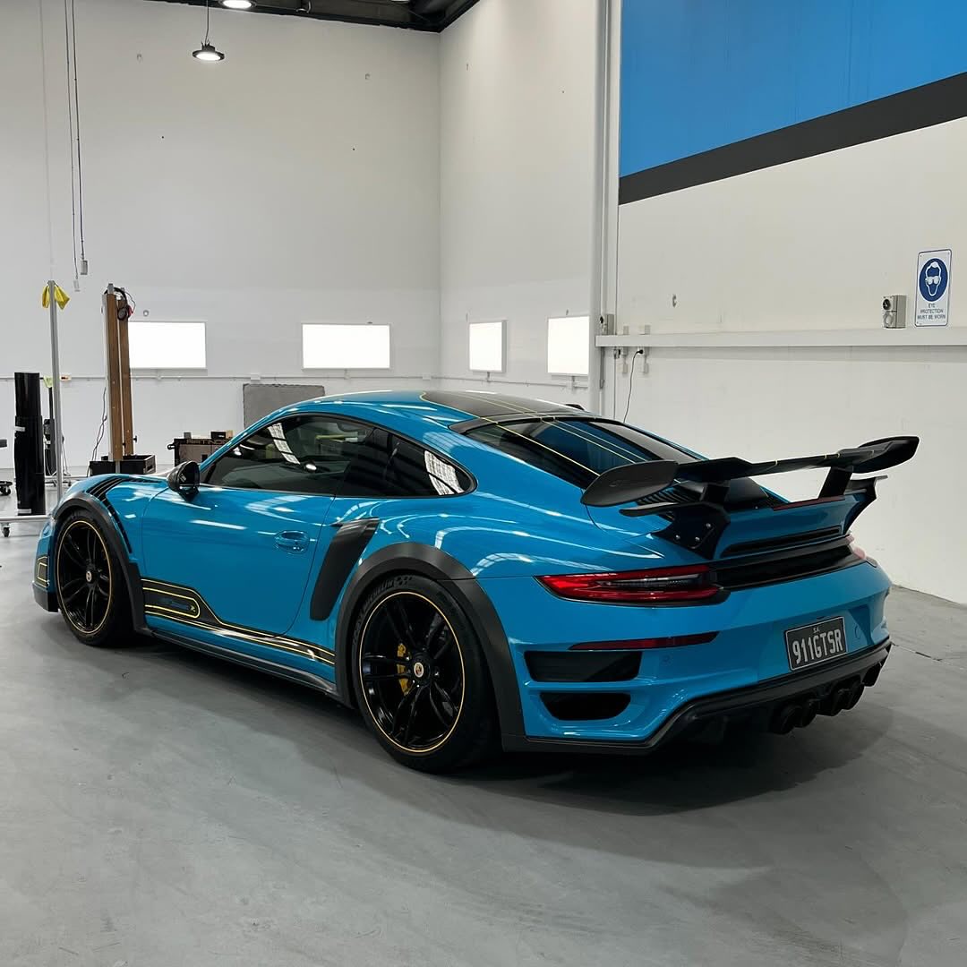 Oracal Gloss Lagoon sports car in a garage