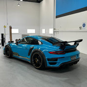 Oracal Gloss Lagoon sports car in a garage