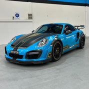 Sports car with Oracal Gloss Lagoon installed in a garage setting