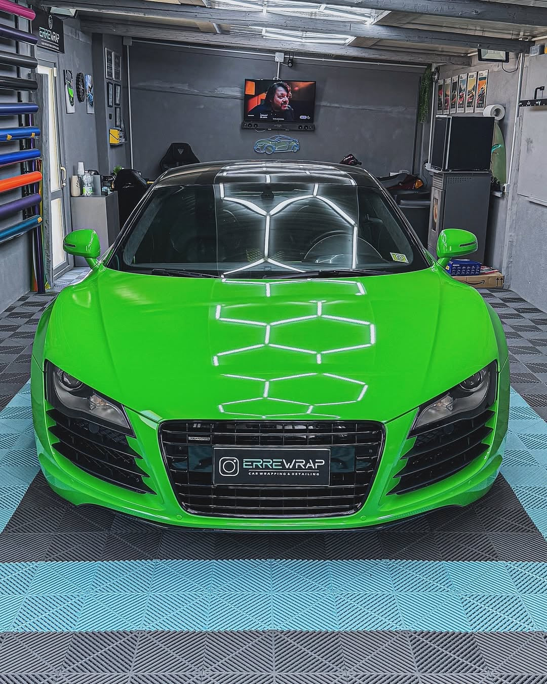 Oracal Gloss Lawn Green wrap installed to a vehicle parked in a garage on a checkerboard floor