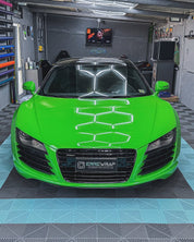 Oracal Gloss Lawn Green wrap installed to a vehicle parked in a garage on a checkerboard floor