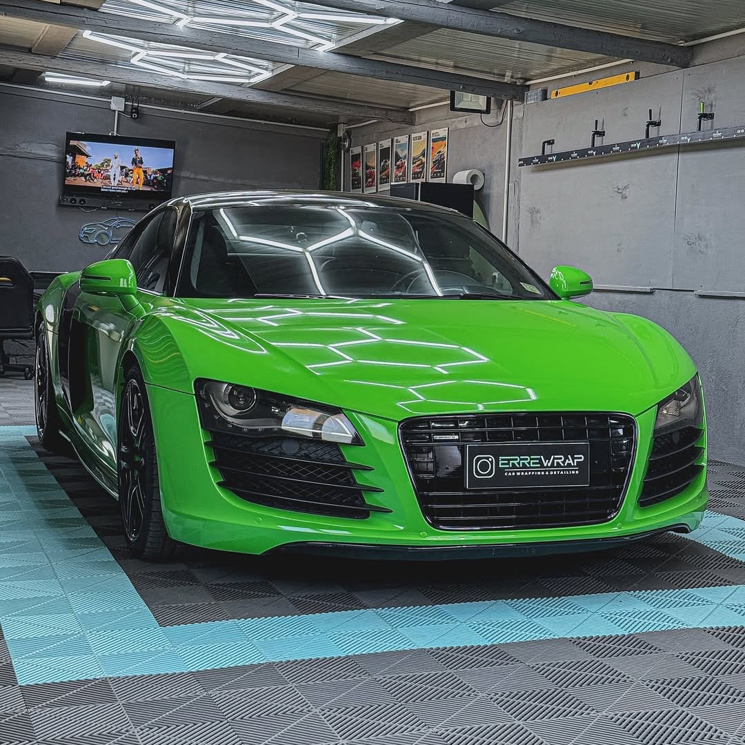Oracal Gloss Lawn Green wrap on a sports car, parked in a garage