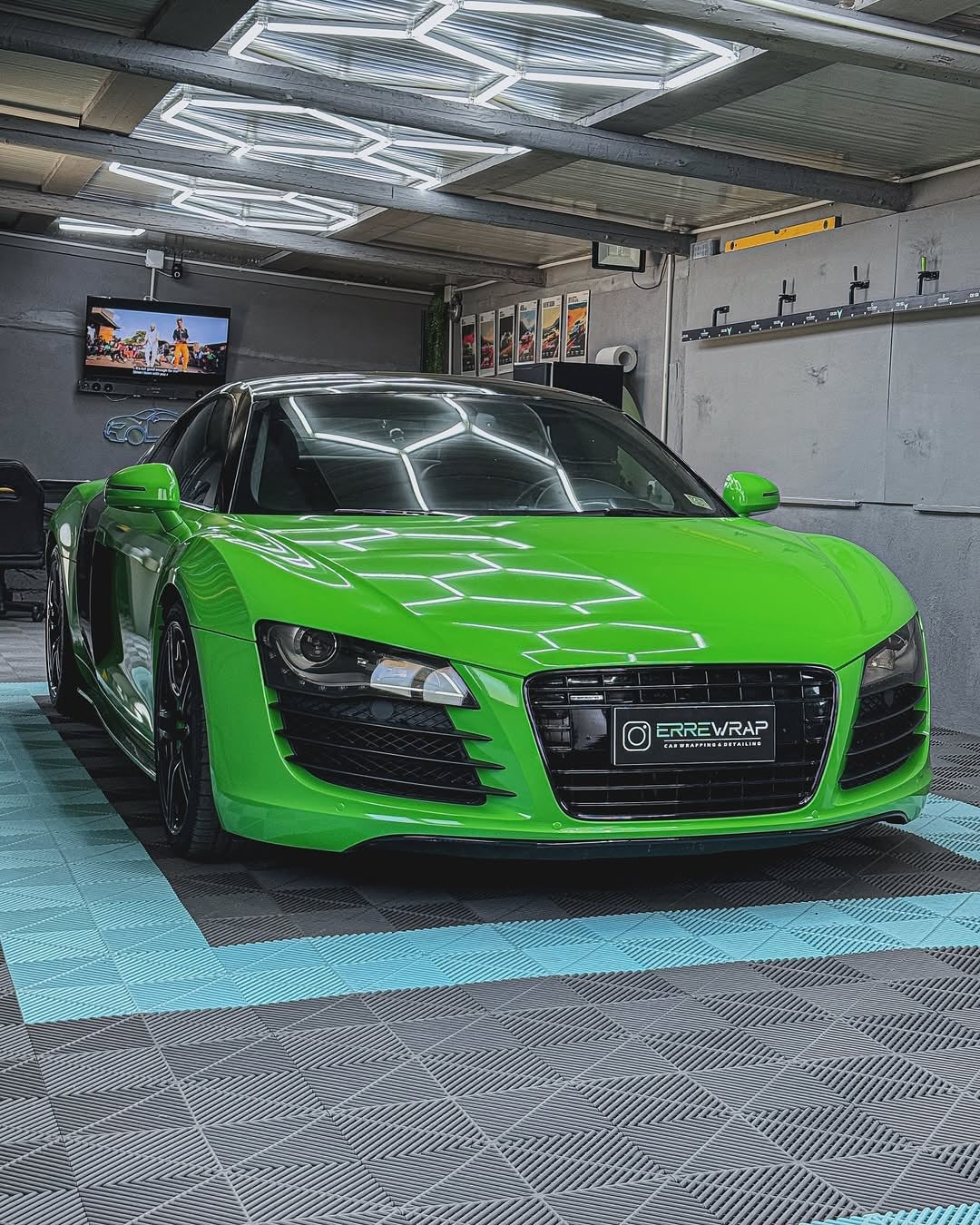 Oracal Gloss Lawn Green wrap on a sports car, parked in a garage